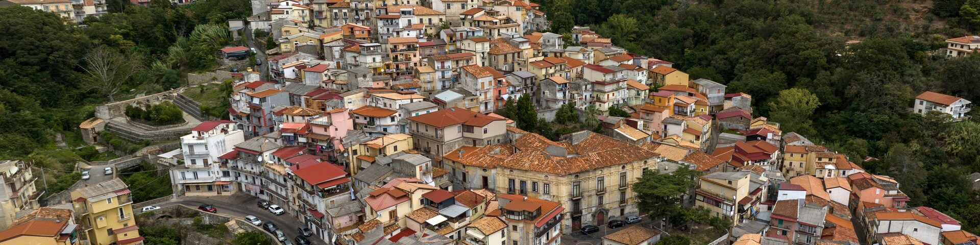 Aerial panoramic view of the historic center of the town of Lamezia Terme, in the province of Catanzaro, Calabria, Italy. These are the old houses of the Nicastro district, perched on the hill.