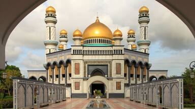 A grand mosque with golden domes and intricate architecture.