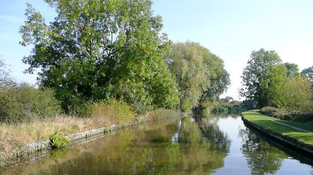 Trent and Mersey Canal near Findern, Derbyshire. The canal takes a fairly straight course here through the flat farm lands on the Trent Valley bottom east of the Buckford bridges. The freight railway line between Stoke (or Burton) and Nottingham (or Derby) runs to the right of the picture less than fifty metres behind the trees.