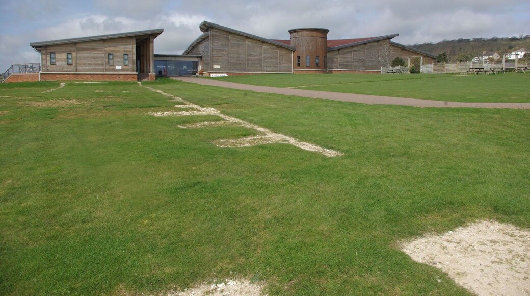Brading Roman Villa The building houses the excavated remains of a Romano-British villa, one of the finest examples in Great Britain. In the foreground the outline locations of what are believed to have been ancillary buildings can be seen. More information is available at: http://www.bradingromanvilla.org.uk/ .