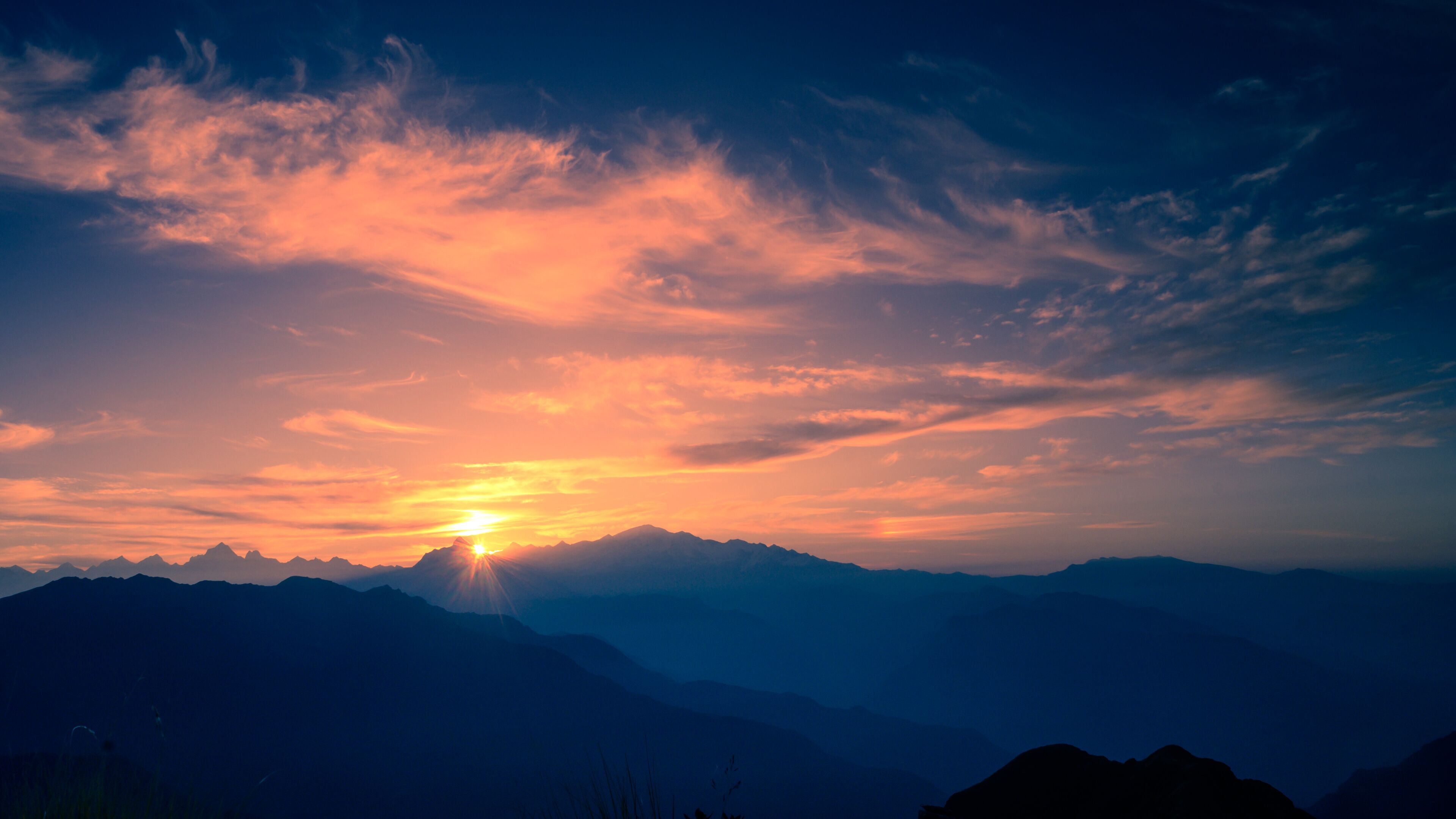 Beautiful natural panoramic landscape view of the sunrise of Himalayan snow mountains from Chandrashila peak in Chopta, Uttarakhand, India,.