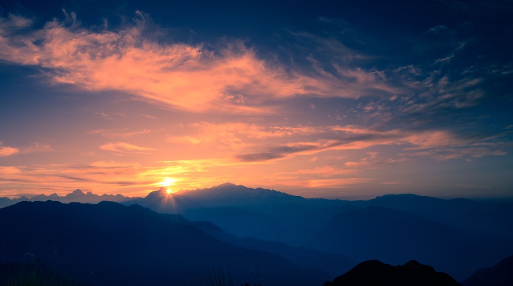 Beautiful natural panoramic landscape view of the sunrise of Himalayan snow mountains from Chandrashila peak in Chopta, Uttarakhand, India,.
