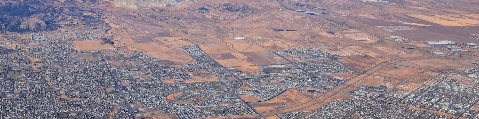 Rocky Mountains, Oquirrh range aerial views, Wasatch Front Rock from airplane. South Jordan, West Valley, Magna and Herriman, by the Great Salt Lake Utah. United States of America. USA.