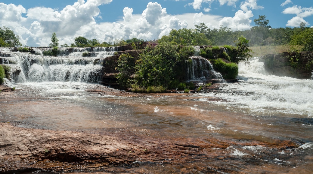 Tropical waterfall with blue sky and white clouds