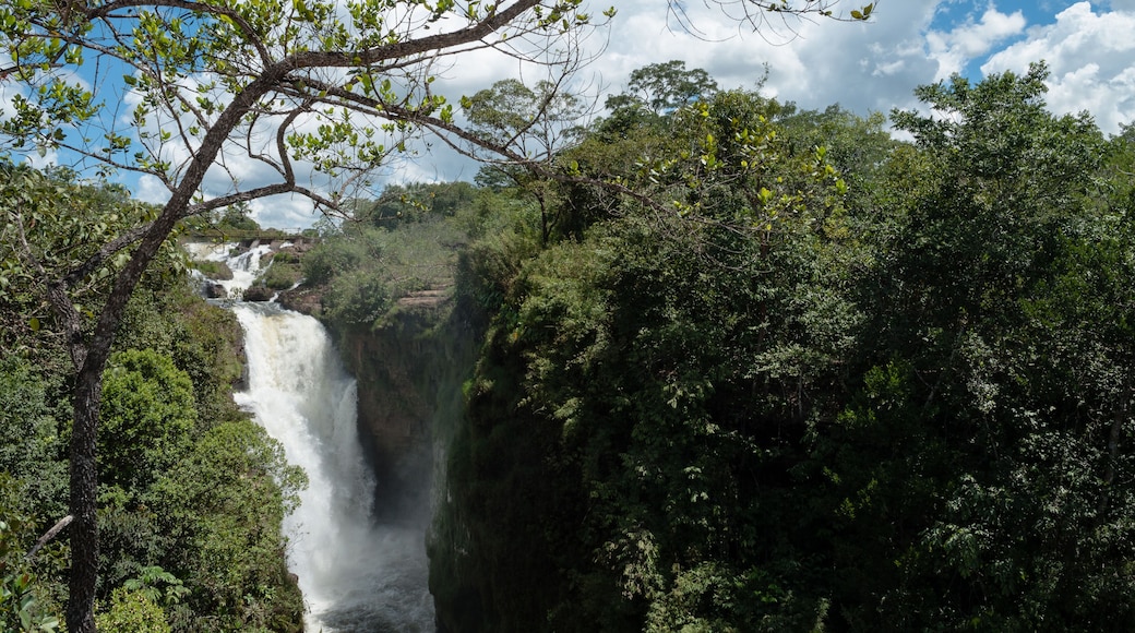 Tropical waterfall with blue sky and white clouds