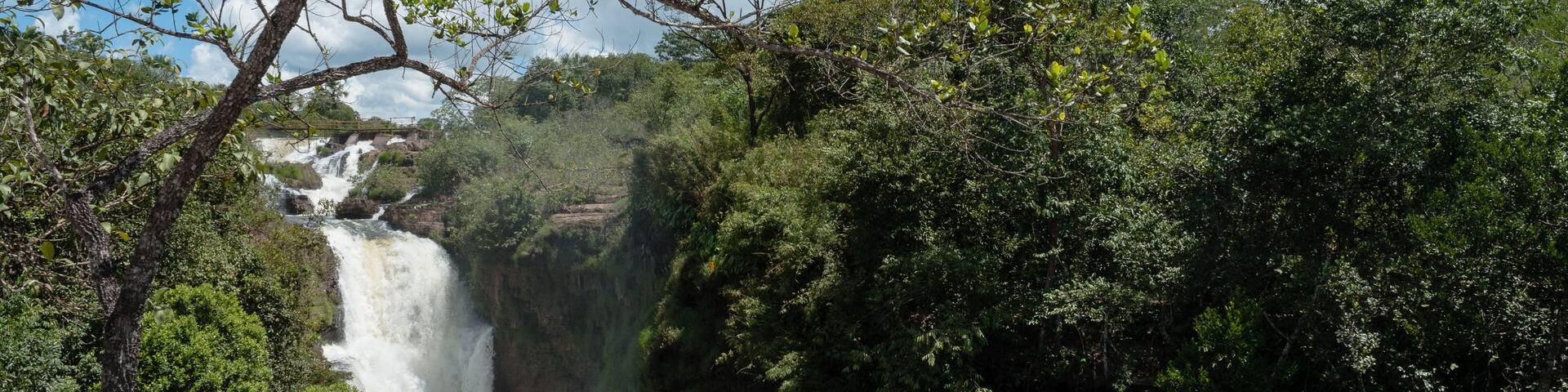 Tropical waterfall with blue sky and white clouds