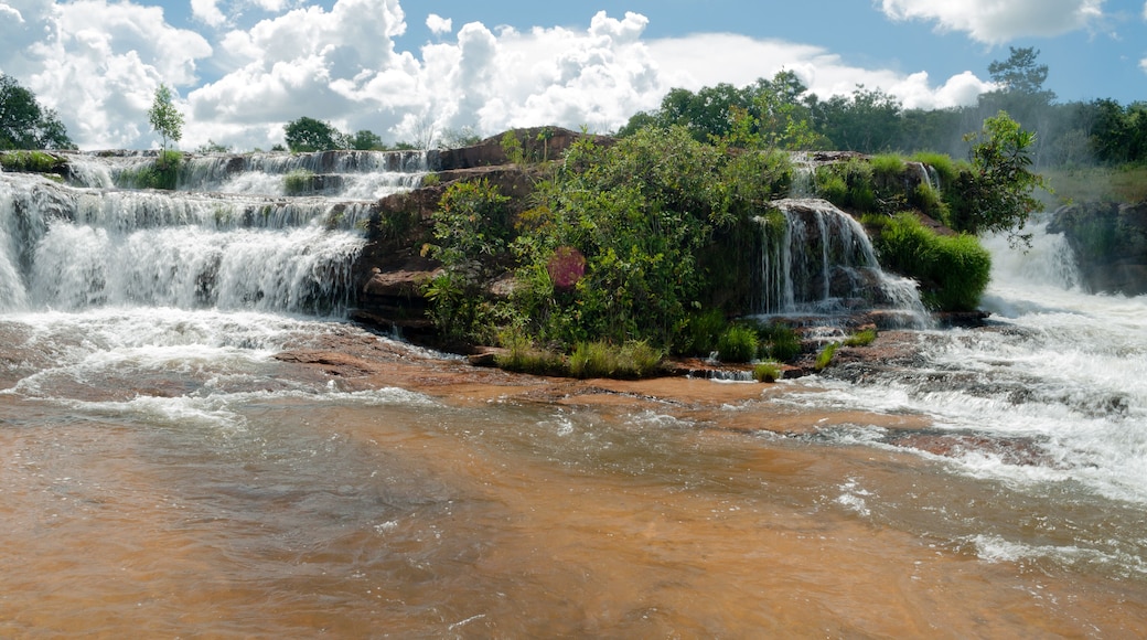 Tropical waterfall with blue sky and white clouds