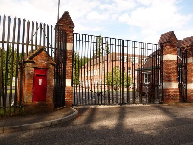 Holton Heath: postbox № BH16 129, Station Road This postbox, without the monarch's insignia, is set into a large brick pillar outside a military establishment. In fact, Station Road is a private road belonging to the Ministry of Defence  that's the impression given by the 'private' signage  but it is a public footpath. The postbox is emptied at 4pm on weekdays and at 9:45am on Saturdays.