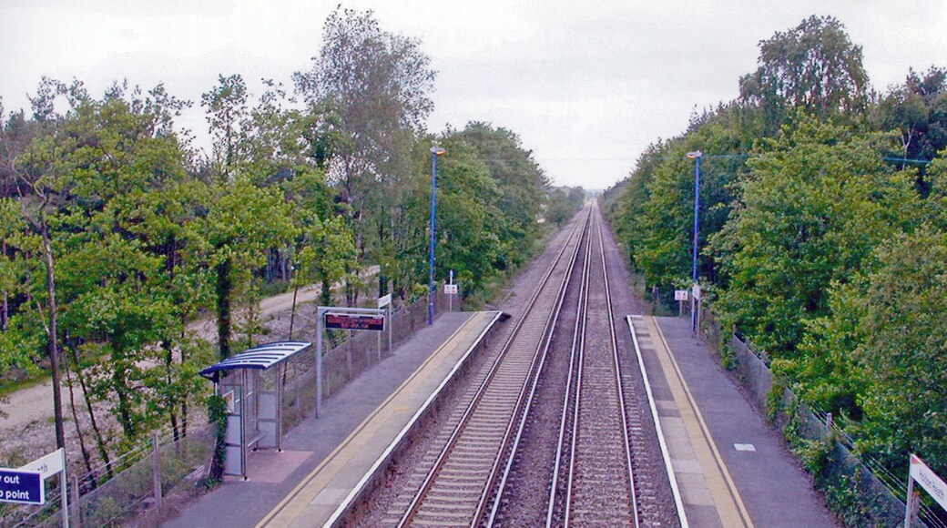 Holton Heath station. View SW, towards Dorchester and Weymouth: ex-LSWR London - Southampton etc. - Bournemouth - Wareham - Dorchester - Weymouth main line, electrified 1988.