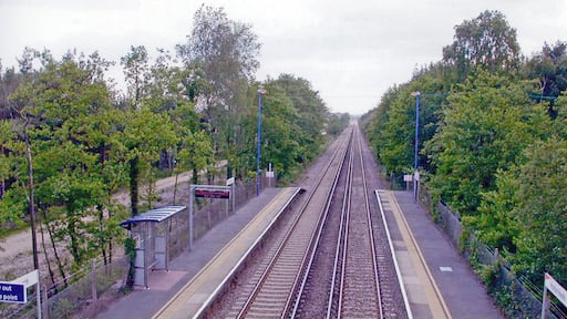 Holton Heath station. View SW, towards Dorchester and Weymouth: ex-LSWR London - Southampton etc. - Bournemouth - Wareham - Dorchester - Weymouth main line, electrified 1988.