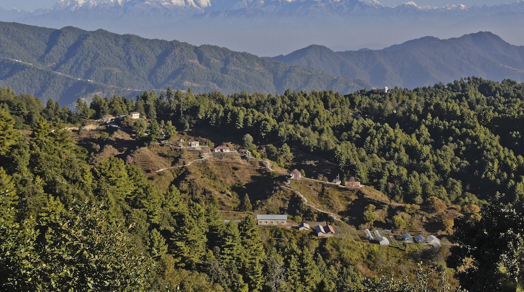 Homes and greenhouses in the foothills of the Himalaya mountain range, viewed from Daman, Nepal