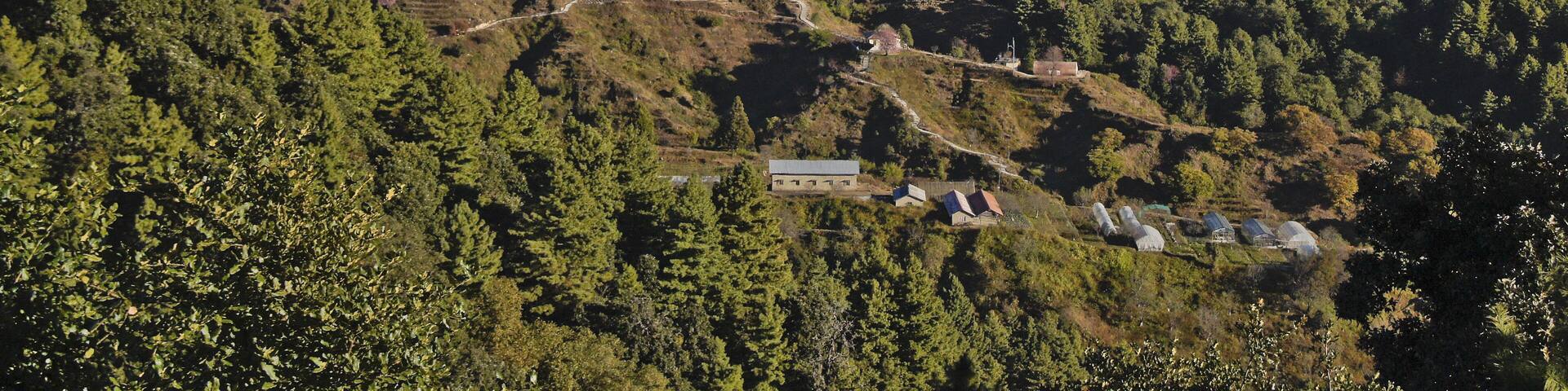 Homes and greenhouses in the foothills of the Himalaya mountain range, viewed from Daman, Nepal