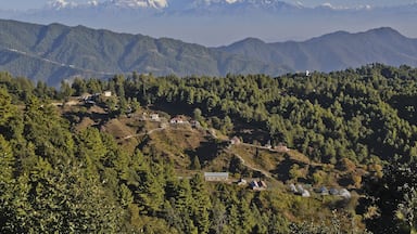 Homes and greenhouses in the foothills of the Himalaya mountain range, viewed from Daman, Nepal
