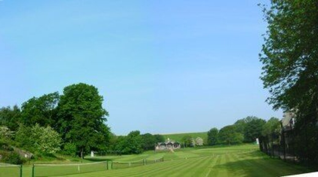 Giggleswick School Chapel and Top Pitch. Four grass tennis courts and "top pitch" (with cricket pavilion) make a wonderful setting for the school chapel (a gift of Walter Morrison of Malham) completed in 1901.
