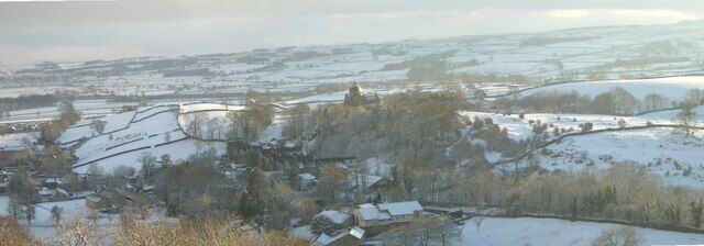 Giggleswick school in the snow. Taken from the top of Giggleswick Quarry the snowscene shows Catteral Hall at the bottom centre, and the dome of Giggleswick School Chapel above the trees centre of picture.
