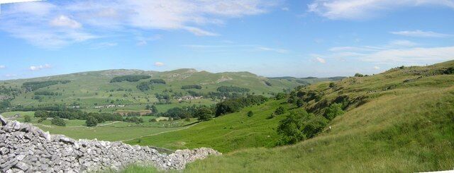 Giggleswick Scar Ribble valley side. Giggleswick Scar is on the right and in the distance Langcliffe along the Settle to Carlisle railway. The very green bracken-covered plateau in the centre of the photograph is filled head height in summer and dies out to reveal rabbit holes and footpaths in the winter.
