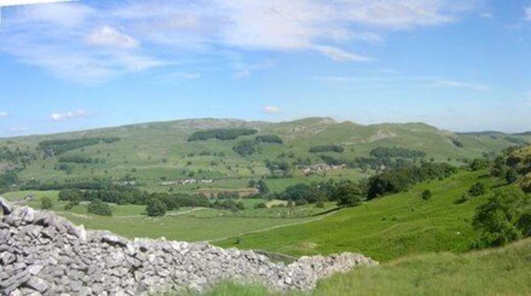 Giggleswick Scar Ribble valley side. Giggleswick Scar is on the right and in the distance Langcliffe along the Settle to Carlisle railway. The very green bracken-covered plateau in the centre of the photograph is filled head height in summer and dies out to reveal rabbit holes and footpaths in the winter.