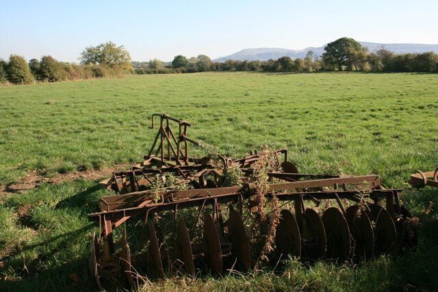 Rusty disc harrow, field, Carr Hill, near to Potto, North Yorkshire, Great Britain.