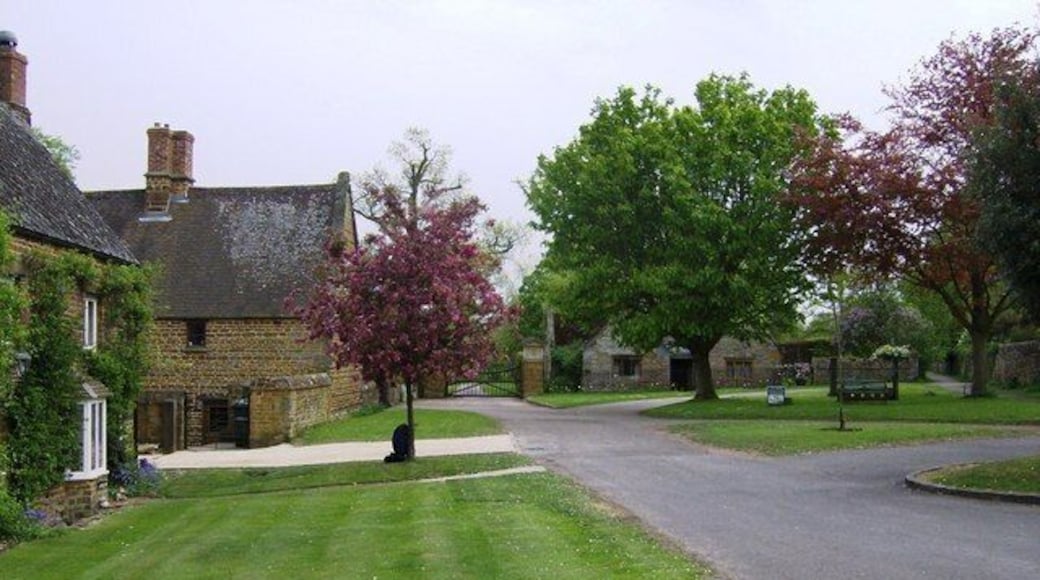 The Green, Eydon, Northamptonshire. The gates ahead are the entrance to Eydon Hall. The second house on the left is Eydon Hall farmhouse.