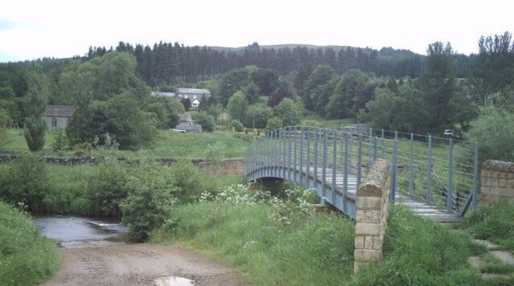 Footbridge over the Rede Footbridge and ford across the River Rede near Byrness. Byrness church can be seen to the left of the photograph.