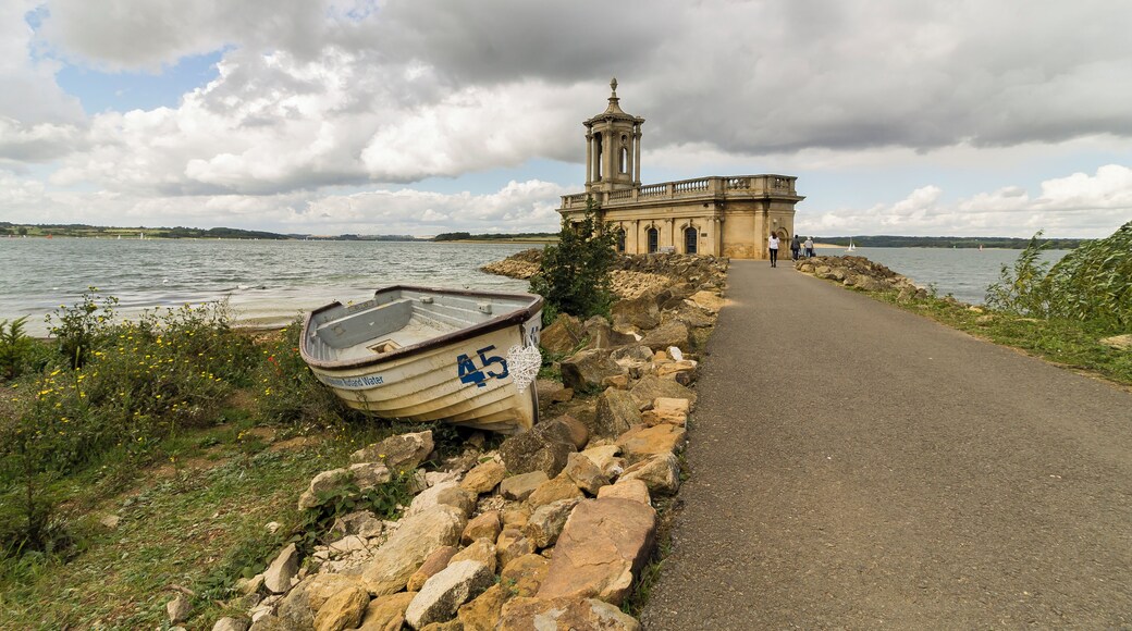Originally built as St Matthew's church in 1826 with a tower by Thomas Cundy, a nave and apse was added in 1911. In 1970 with the formation of Rutland Water the valley had to be cleared, so the church was deconsecrated and scheduled for demolition. A trust was organised with the aim of rescuing the building, and various proposals were considered.
It was decided that the lower level of the church should be filled in to create a new floor. A causeway was built connecting it to the shore and an embankment was constructed around the building with a layer of boulders as a defensive breakwater to prevent erosion. It is now used as a wedding venue and museum. Pic by Jenny