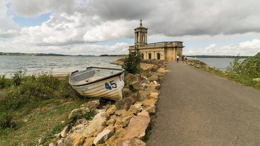 Originally built as St Matthew's church in 1826 with a tower by Thomas Cundy, a nave and apse was added in 1911. In 1970 with the formation of Rutland Water the valley had to be cleared, so the church was deconsecrated and scheduled for demolition. A trust was organised with the aim of rescuing the building, and various proposals were considered.
It was decided that the lower level of the church should be filled in to create a new floor. A causeway was built connecting it to the shore and an embankment was constructed around the building with a layer of boulders as a defensive breakwater to prevent erosion. It is now used as a wedding venue and museum. Pic by Jenny