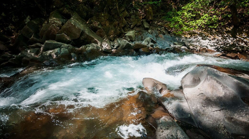 Blue Lagoon, mountain river among the rocks in the forest