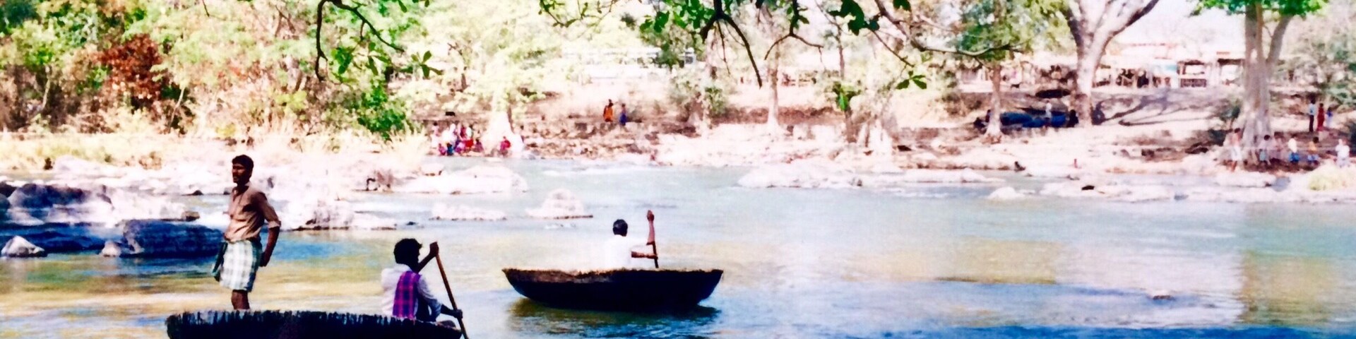 A river scene with boats and people.