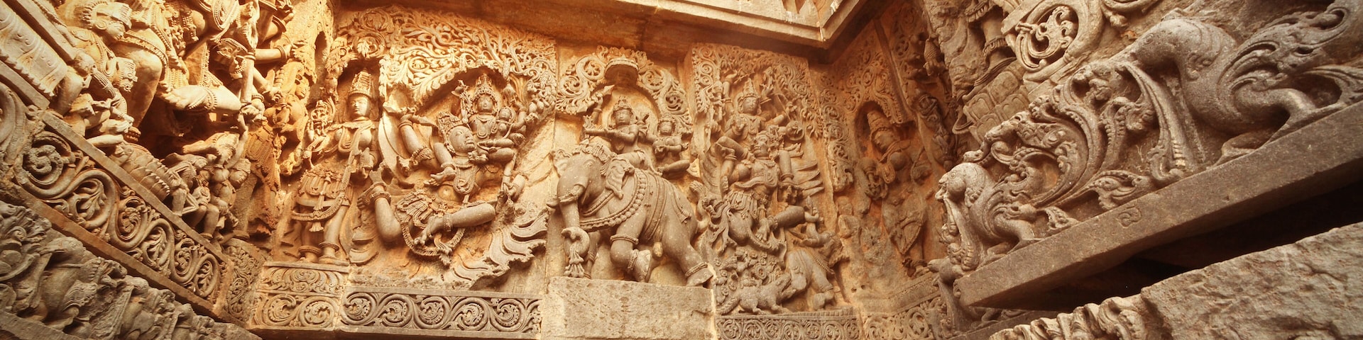 India Belur temple. Old stone wall with sculptures