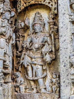 Beautiful figure carved in soapstone in Hoysaleswara Temple, Halebeedu, India.