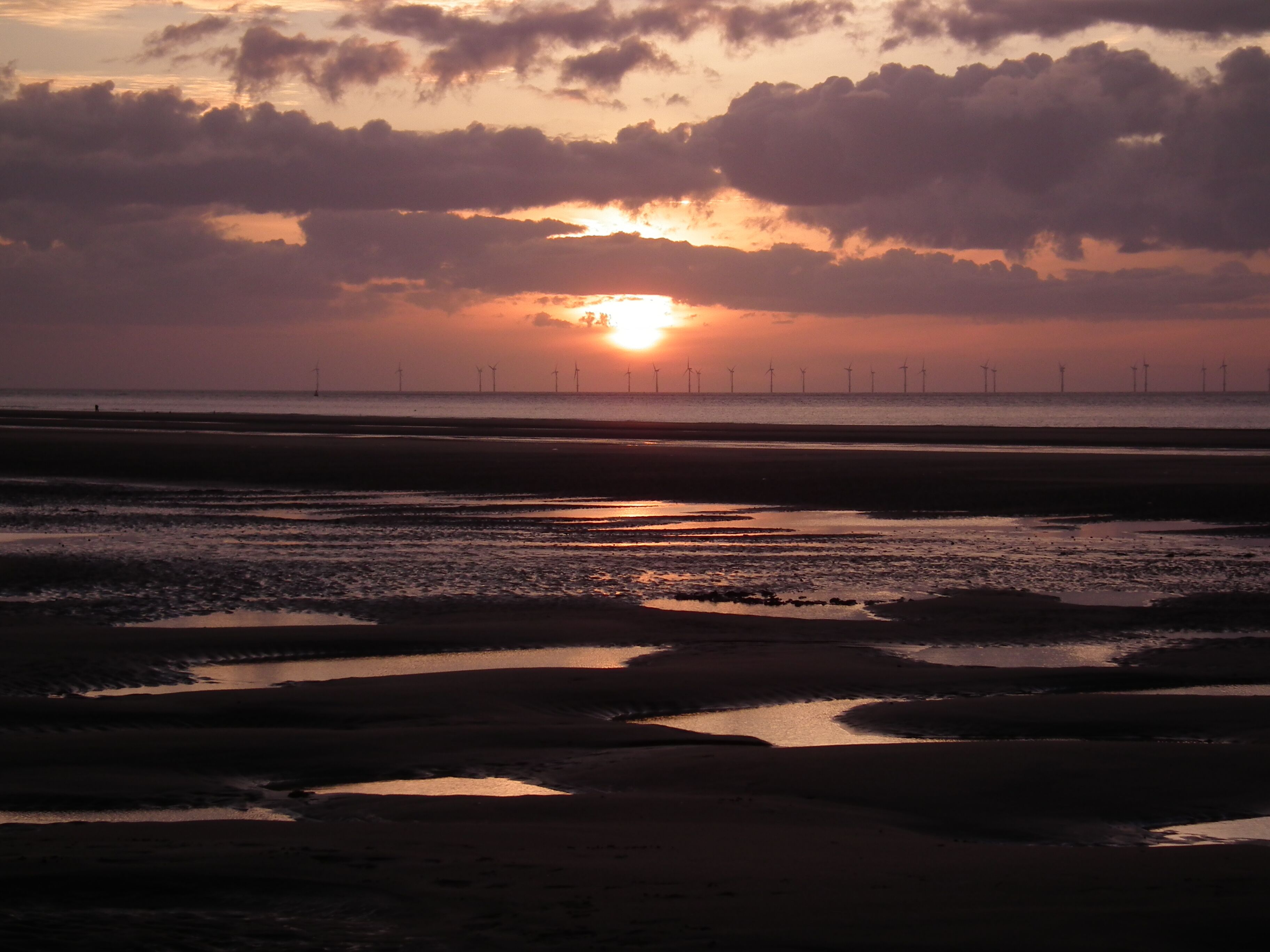 machlud haul ar y traeth