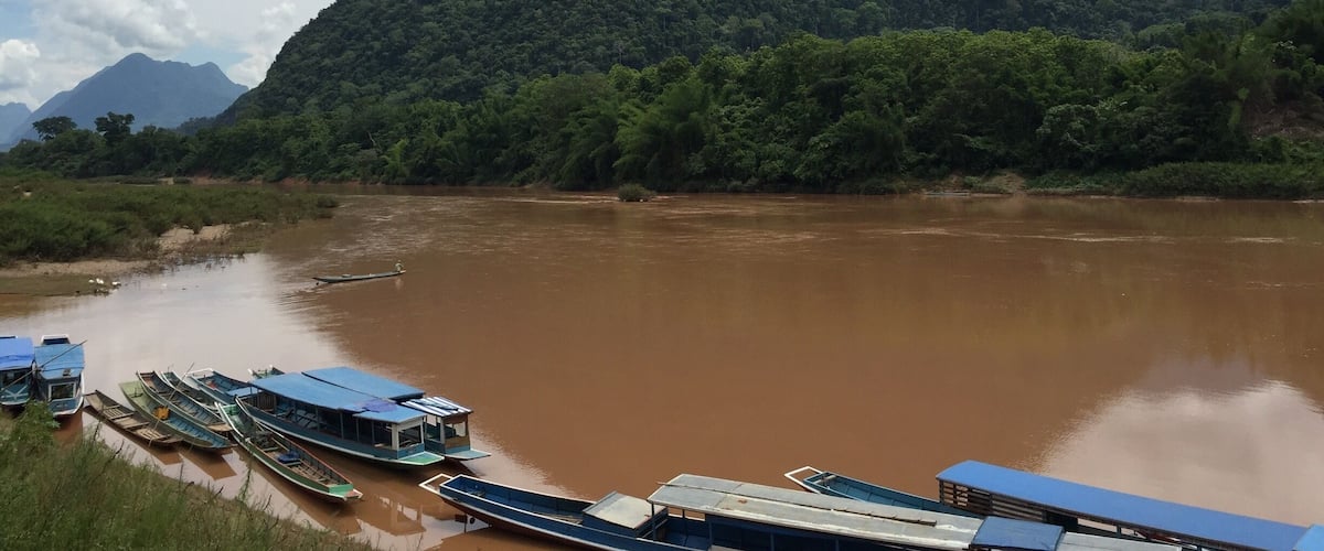 View over Nam ou River. Taking 3 Dirt Bikes on small riverboat.