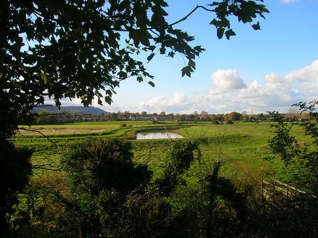 River Adur Taken from the steps that lead down from Church Lane to the river, the footbridge over a drainage ditch can be seen bottom right. Over the far side of the river is the outer suburbs of Steyning.