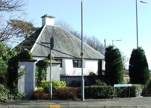 Auchenbothie Lodge. On the A761 Port Glasgow Road. Built in 1901, designed by Charles Rennie Mackintosh. Unfortunately now hidden from clear view behind street furniture and trees. This was the lodge for Auchenbothie house 359477 See Mackintosh's more famous Windyhill in Kilmacolm at 351017 and the nearby Cloak 842547.