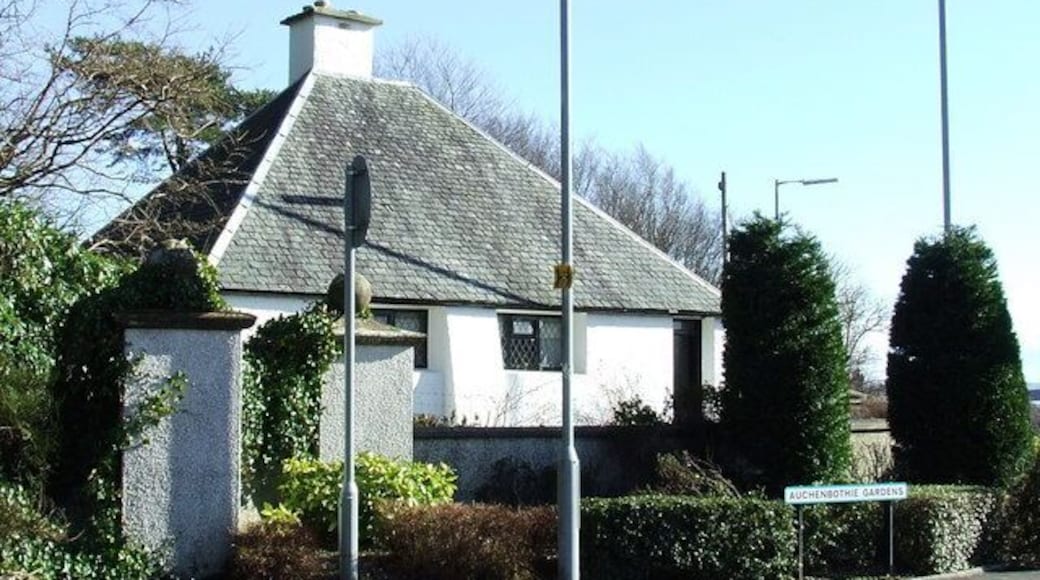 Auchenbothie Lodge. On the A761 Port Glasgow Road. Built in 1901, designed by Charles Rennie Mackintosh. Unfortunately now hidden from clear view behind street furniture and trees. This was the lodge for Auchenbothie house 359477 See Mackintosh's more famous Windyhill in Kilmacolm at 351017 and the nearby Cloak 842547.