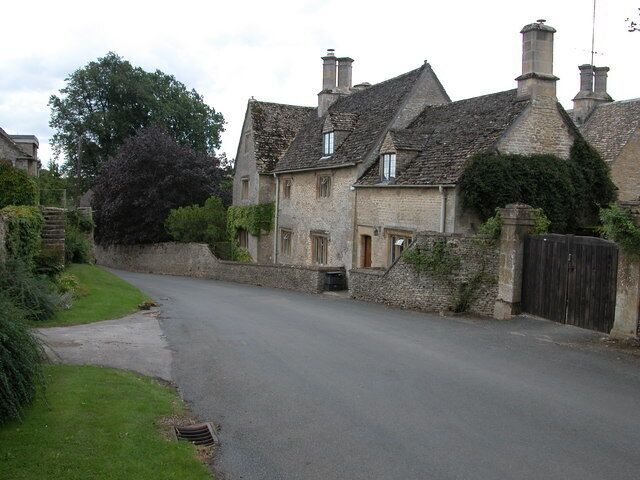 House in Coln St Dennis. Cotswold stone house on the roadside in the village of Coln St Dennis.