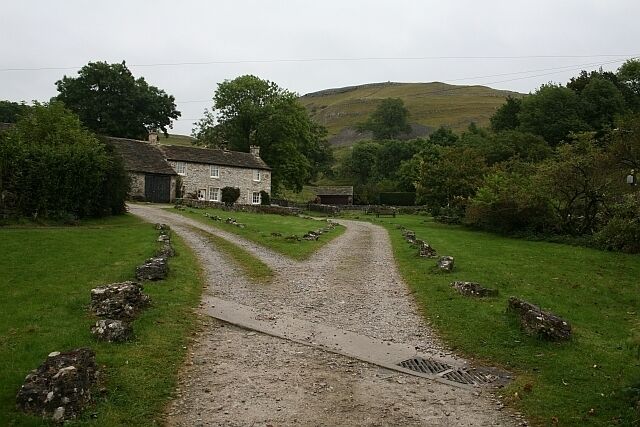Track and Cottage at Conistone. The track to the right of the cottage is the beginning of a footpath through Bull Scar and meets with the Dalesway and Scot Gate Lane at the top of the scar.