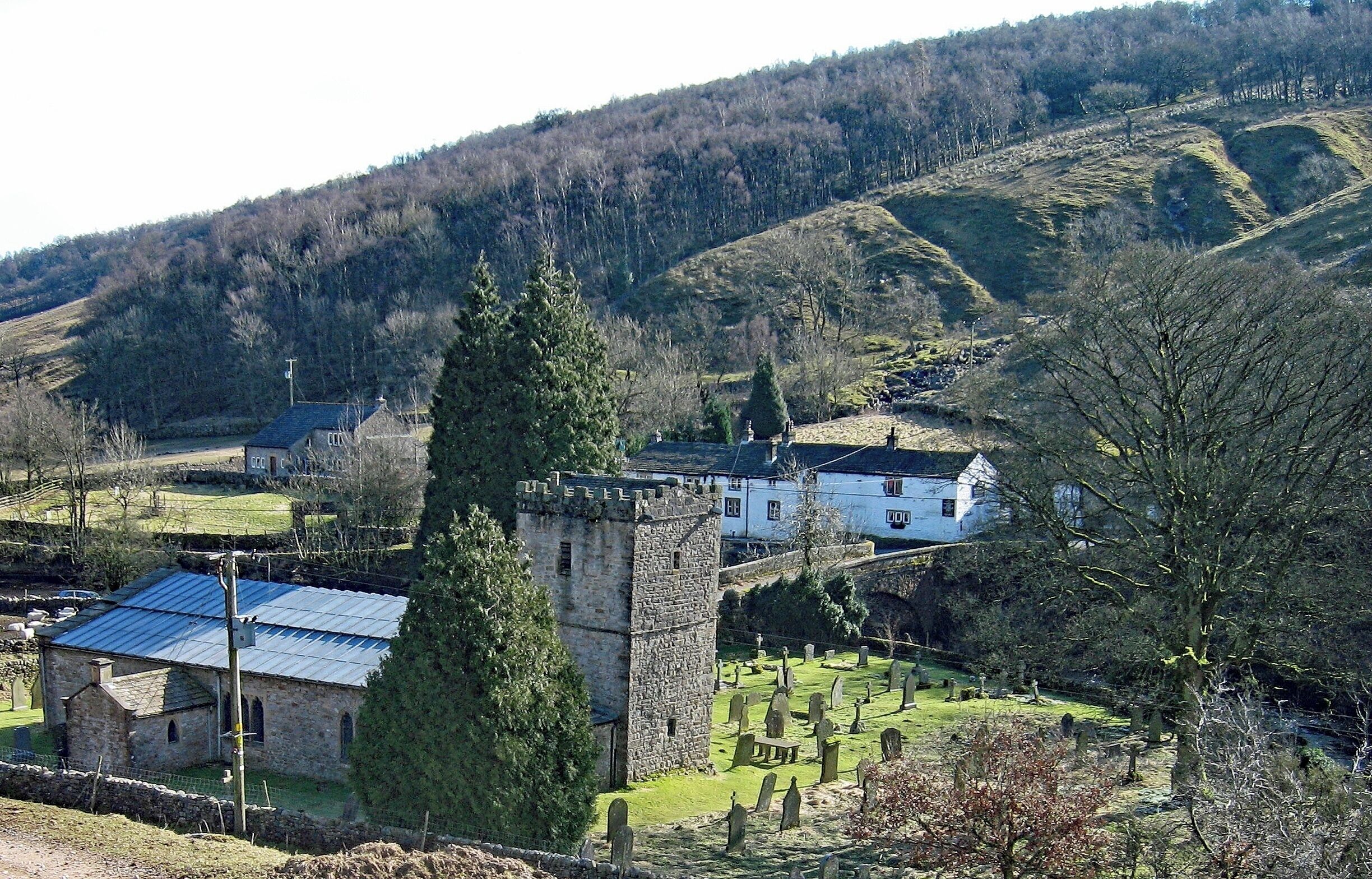 Hubberholme is an old village in the Yorkshire Dales, England, at the point where Langstrothdale meets Wharfedale. The village was a favourite place of writer and playwright J.B. Priestley. The Norman church, St Michael’s & All Angels, is the resting place of his ashes. The George Inn, which is the whitewashed building here, is over a bridge opposite the Church. A lit candle sits on the bar when the pub is open and serving. This is a tradition from local auctions for agricultural land or grazing.  These are still held in The George  and the last bid to be received before the candle goes out is the winner. #GreatOutdoors