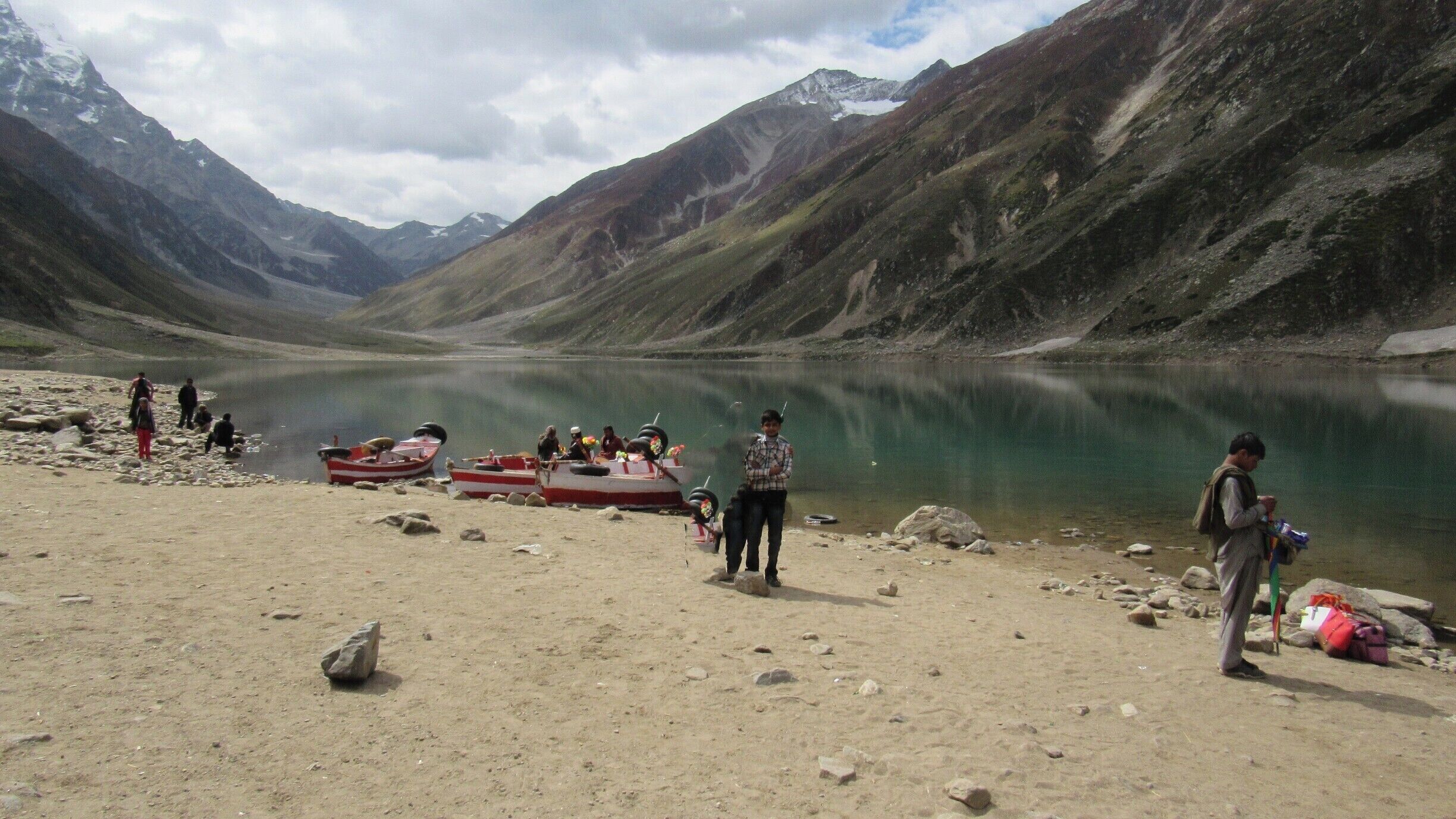Nearly 8km from Naran and situated at the height of 10,578 feet (3,224 meters) above sea level, Saiful Muluk is the most beautiful lake in the Kaghan Valley. Offering splendid views of the Peak of Malika Parbat (Mountain) this lake is a water source for River Kunhar. 

We visited Saiful Muluk on 16th September 2015, the pleasant smell and the pollution free environment, make us feel that we are in some other world. The weather is sort of undefinable as the wind is cold and the areas where there are clouds and shade it feels very cold but at the area where the sun is shining it feels too hot. The water of the lake was cold, but we all were enjoying it very much. The water is too clear and reflection of nearby mountain seen in the lake is amazing, it feels like a huge mirror lying on the ground.

http://karachitokhunjerab.blogspot.com/
