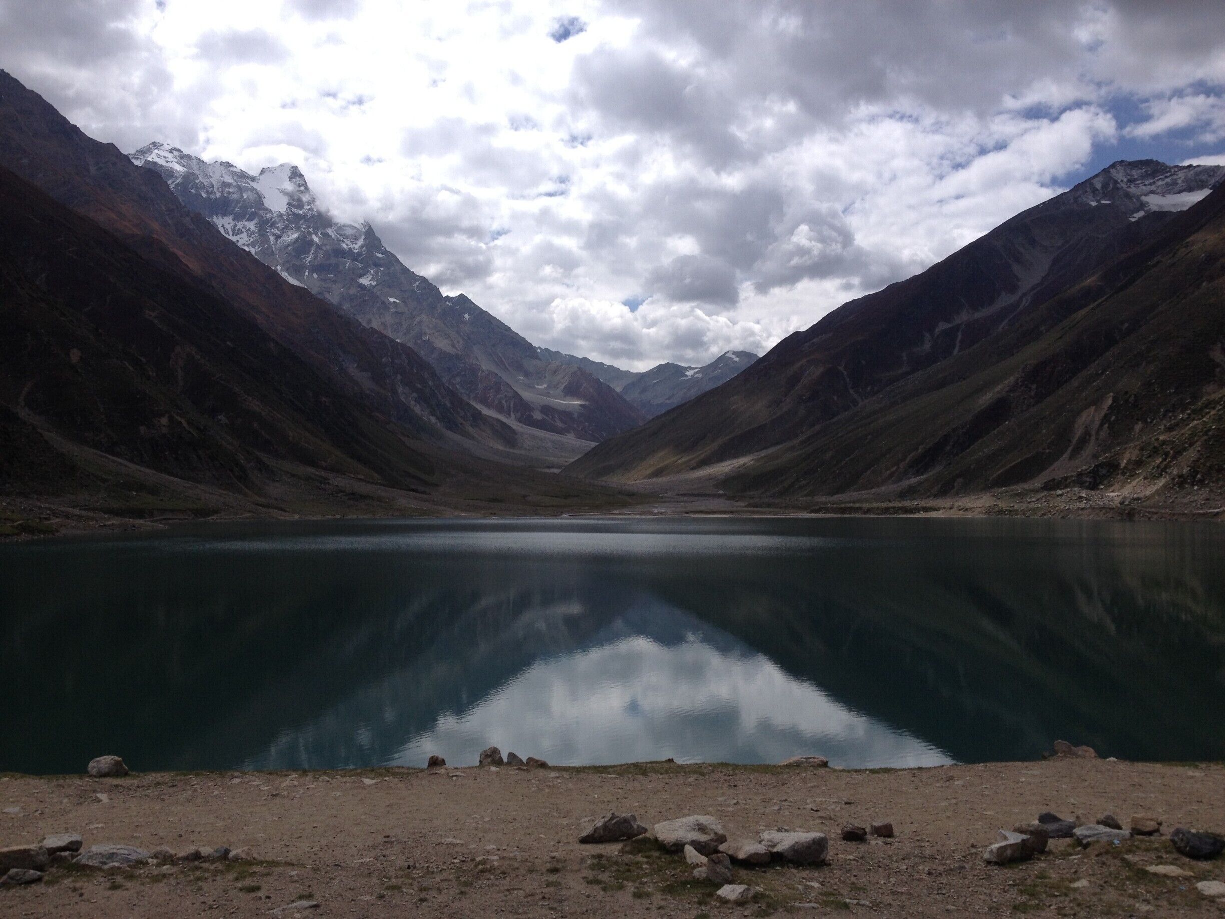 Nearly 8km from Naran and situated at the height of 10,578 feet (3,224 meters) above sea level, Saiful Muluk is the most beautiful lake in the Kaghan Valley. Offering splendid views of the Peak of Malika Parbat (Mountain) this lake is a water source for River Kunhar. 
We visited Saiful Muluk on 16th September 2015, the pleasant smell and the pollution free environment, make us feel that we are in some other world. The weather is sort of undefinable as the wind is cold and the areas where there are clouds and shade it feels very cold but at the area where the sun is shining it feels too hot. The water of the lake was cold, but we all were enjoying it very much. The water is too clear and reflection of nearby mountain seen in the lake is amazing, it feels like a huge mirror lying on the ground.
http://karachitokhunjerab.blogspot.com/
