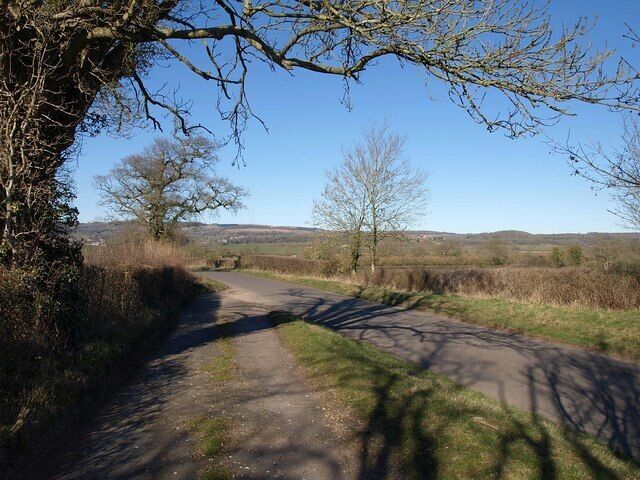 Roads at Prospect Cottage I suspect the roadway from which this was taken was the former route of the lane; it now forms the entrance to the cottage. This road is from Woodford to Dulcote; behind the camera it has just performed a sharp bend, a little less sharp after the road re-alignment.