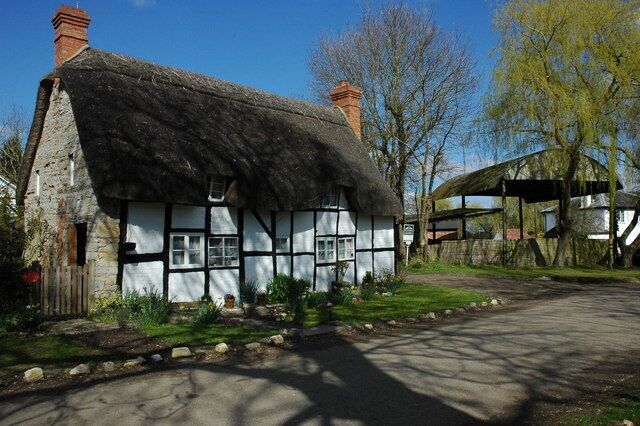 Thatched cottage in Dorsington Half-timbered thatched cottage near the church in Dorsington.