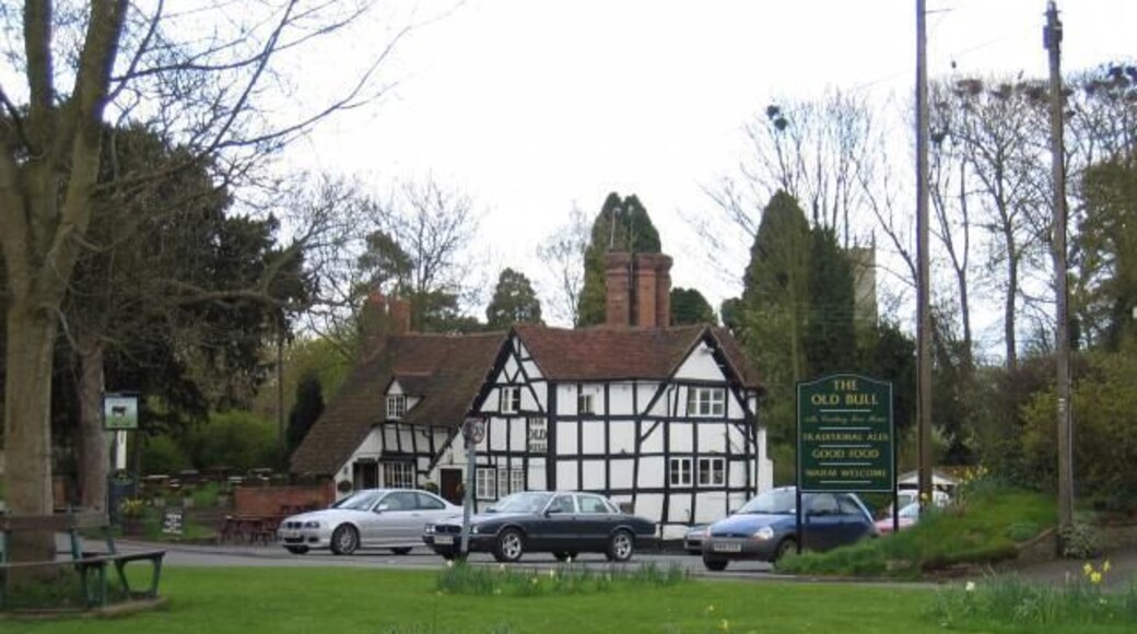 Inkberrow. The village green in the foreground, with the Old Bull, of Ambridge fame, and the tower of St Peter's church behind.
