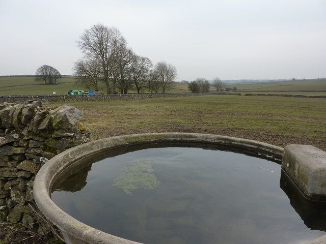 Drinking trough in a wall On a path approaching Flagg, to Mycock Lane.