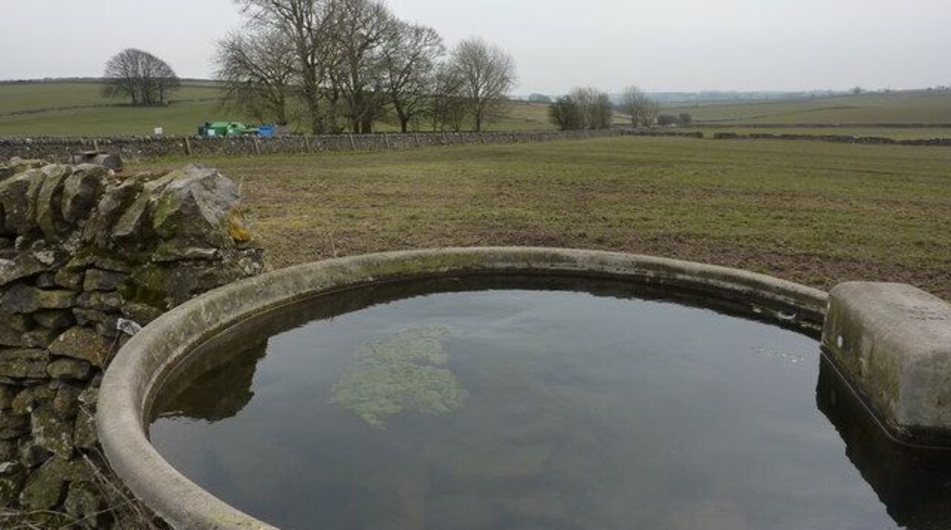Drinking trough in a wall On a path approaching Flagg, to Mycock Lane.