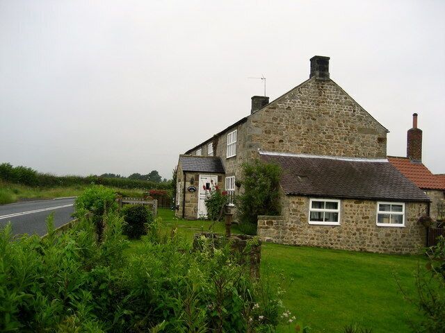 Clip'd Thorn Farm Farm on the main B6265 Ripon/Pateley Bridge Road