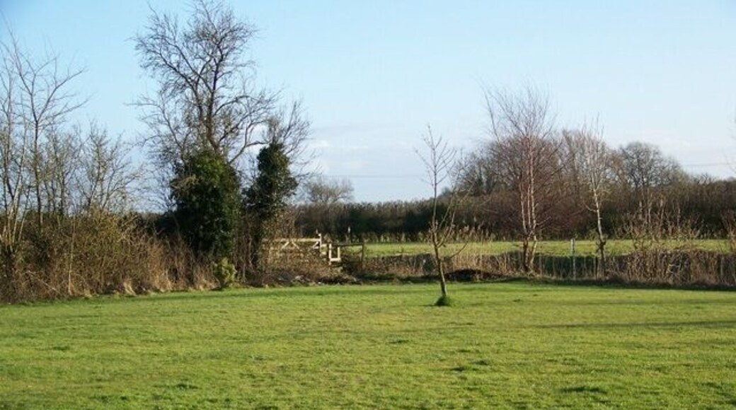 Footpath, Lower Weare The footpath leaves the A38 to cross the area of lawn before joining the footpath beside the River Axe.