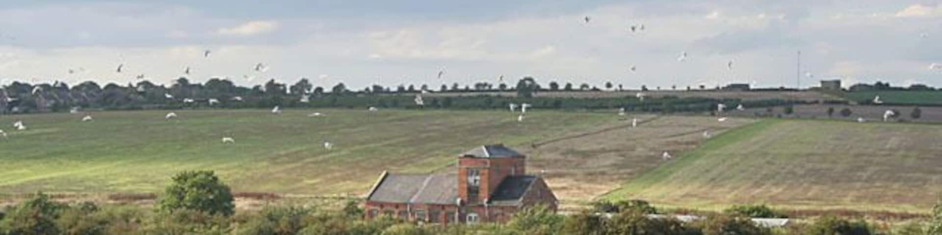 Old station, South Luffenham. The old station yard houses several small industrial units now. The railway is the mainline from Leicester to Stansted Airport, passing through Melton Mowbray and Oakham before reaching this point. (I've picked Disused station as the category as it isn't used by the railway anymore.)