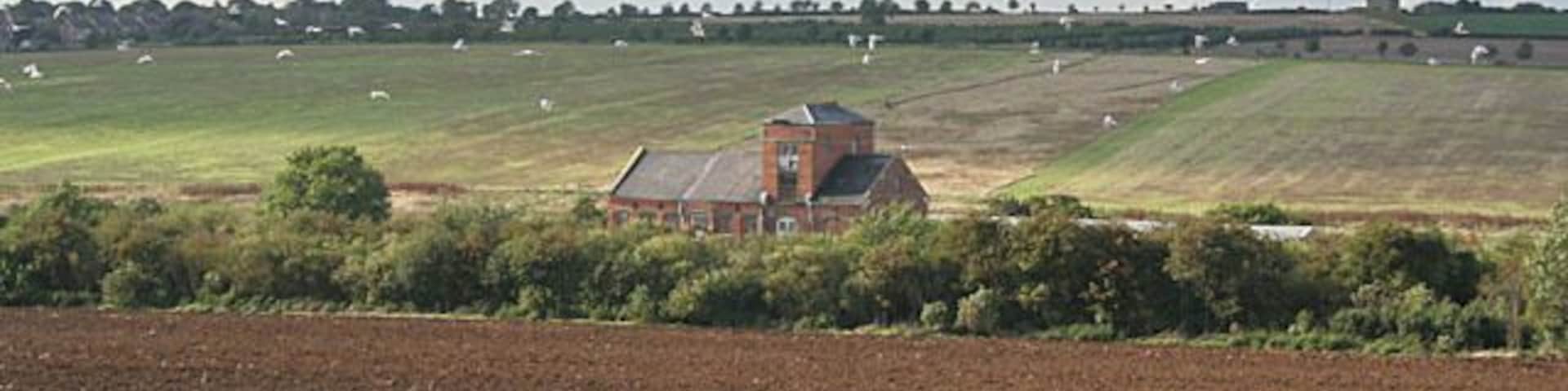 Old station, South Luffenham. The old station yard houses several small industrial units now. The railway is the mainline from Leicester to Stansted Airport, passing through Melton Mowbray and Oakham before reaching this point. (I've picked Disused station as the category as it isn't used by the railway anymore.)