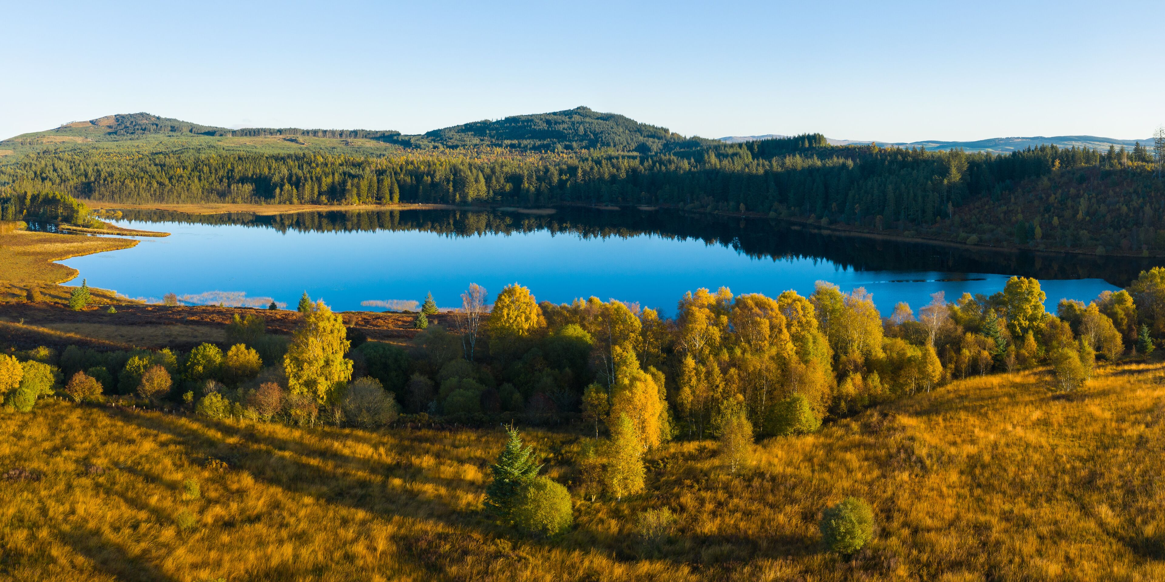 Aerial view of Stroan Loch in autumn, Galloway Forest, Dumfries & Galloway, Scotland